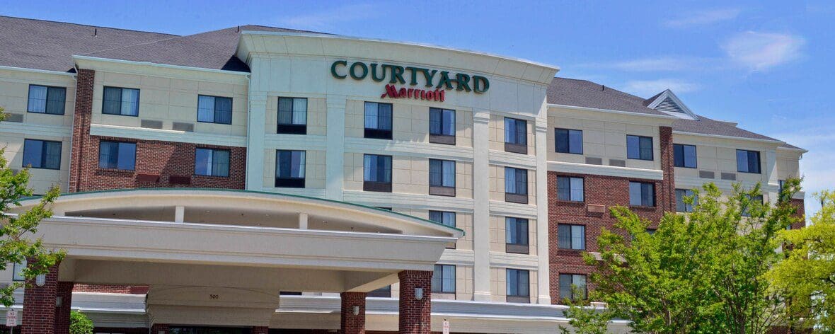 Front view of a Courtyard Marriott hotel building.